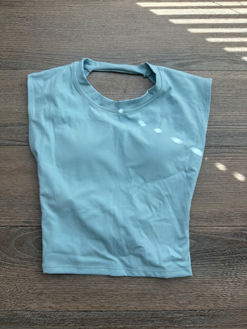 Light Blue Twist-Back Athletic Crop with Sewn-in Bra.